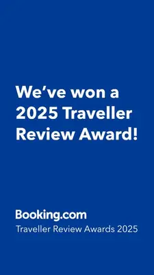 a blue sign that says weve won a traveler review award at Green apartament 21 in Oświęcim