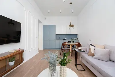 a living room with a couch and a table at One Bedroom Apartment - Dietla 68 street in Kraków