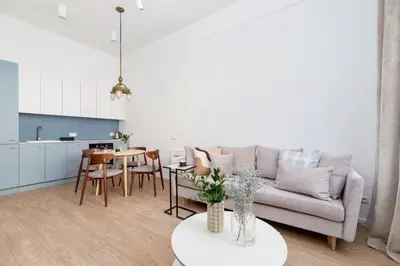 a living room with a couch and a table at One Bedroom Apartment - Dietla 68 street in Kraków