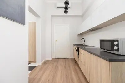 a kitchen with a microwave and a counter top at Studio Apartment - Dietla 109 street in Kraków