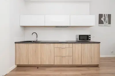 a kitchen with a sink and a microwave at Studio Apartment - Dietla 109 street in Kraków