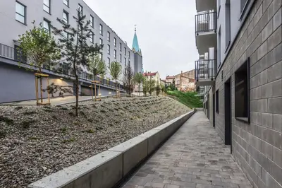 an empty street in a city with buildings at Apartament Powstańców 19 in Oświęcim