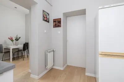 a kitchen and dining room with a sliding door at 3-bedroom apartment - Old Town- Blich 9 in Kraków