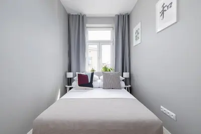 a bed in a room with a window at 3-bedroom apartment - Old Town- Blich 9 in Kraków