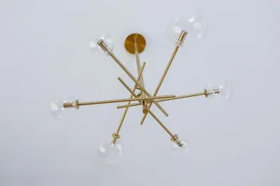 a chandelier hanging from a ceiling at Main Square - Modern Apartment - 7 Gertrudy street in Kraków