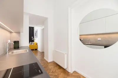 a bathroom with a sink and a mirror at Main Square - Modern Apartment - 7 Gertrudy street in Kraków