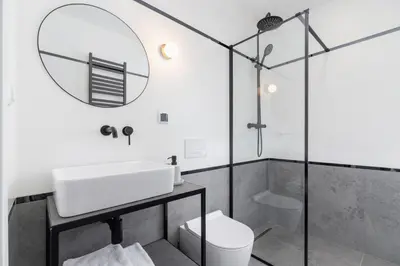 a bathroom with a sink and a mirror at Main Square - Modern Apartment - 7 Gertrudy street in Kraków