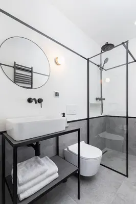 a bathroom with a sink and a toilet at Main Square - Modern Apartment - 7 Gertrudy street in Kraków