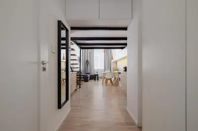 a hallway with a living room and a dining room at Studio z Klimatyzacją na Krakowskim Kazimierzu by Noclegi Renters in Kraków