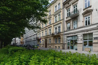 a row of tall buildings on a city street at Studio z Klimatyzacją na Krakowskim Kazimierzu by Noclegi Renters in Kraków