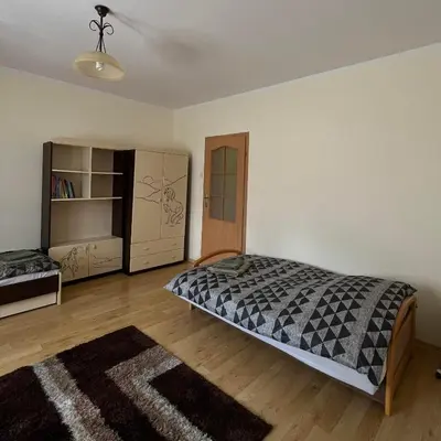 a bedroom with a bed and a book shelf at Pogodny Dom in Włosienica