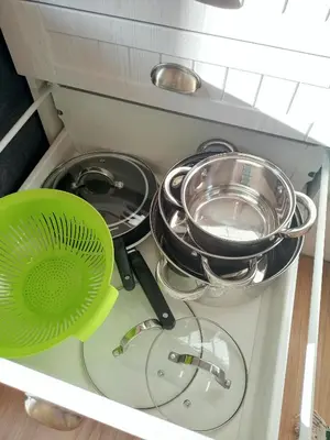 a group of pots and pans in a kitchen drawer at Gawlasoowka in Inwałd