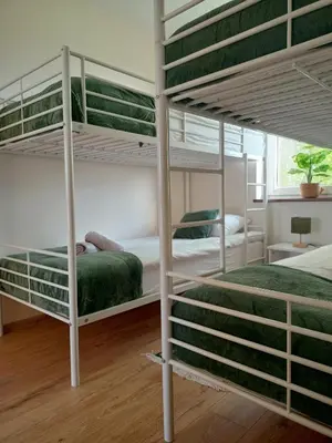 a bedroom with two bunk beds and a window at Gawlasoowka in Inwałd