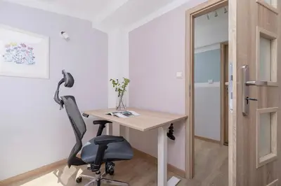 an office with a desk and a chair and a door at 3-Bedroom apartment in the centre - Old Town in Kraków