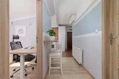 an open door leading into an office with a desk at 3-Bedroom apartment in the centre - Old Town in Kraków