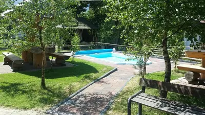 a park with a bench and a swimming pool at Willa Pod Dębami - SALA ZABAW - Małpi Gaj - blisko centrum in Rabka