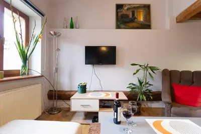 a painting of a painting of a forest at Sky's the limit! Spacey loft in Kraków
