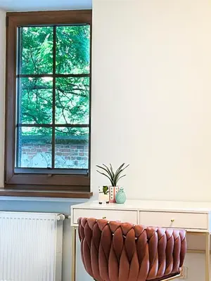 a bench in front of a window in a room at Large Apartment 2 bedrooms and living room, Kazimierz District in Kraków