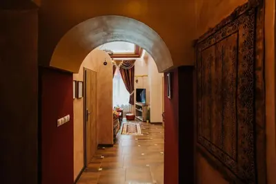 a hallway with an archway in a house at Apartament Shahrazad in Kraków