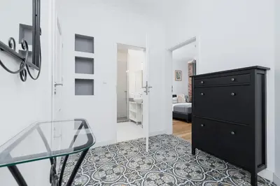 a room with a glass table and a dresser at Two Bedroom Apartment- Brzozowa - Kazimierz in Kraków