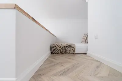 a room with white walls and a wooden floor at Old Town - Modern Apartment - 7 Gertrudy street in Kraków
