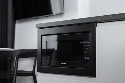 a microwave oven sitting on top of a counter at Old Town - Modern Apartment - 7 Gertrudy street in Kraków