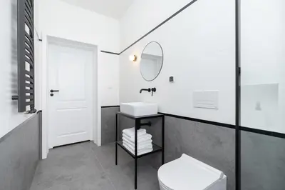 a white bathroom with a sink and a toilet at Wawel Castle - Modern Apartment - 7 Gertrudy in Kraków