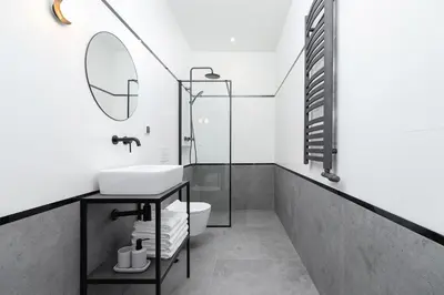 a bathroom with a sink and a mirror at Wawel Castle - Modern Apartment - 7 Gertrudy in Kraków