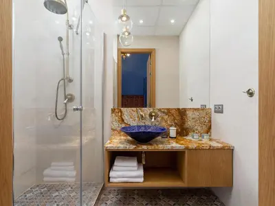 a bathroom with a sink and a shower at Main Square - Szpitalna 9 Street in Kraków
