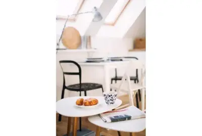 a room with a table with a plate of donuts on it at 1 - bedroom Apartment - 11 Pilsudskiego Street in Kraków