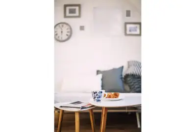 a living room with a coffee table and a couch at 1 - bedroom Apartment - 11 Pilsudskiego Street in Kraków