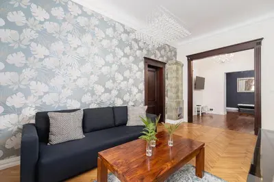 a living room with a couch and a table at Main square - Old Town - Floriańska 47 Street in Kraków