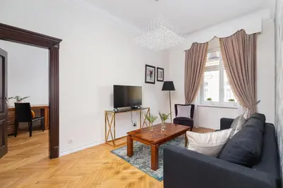 a living room with a couch and a table at Main square - Old Town - Floriańska 47 Street in Kraków