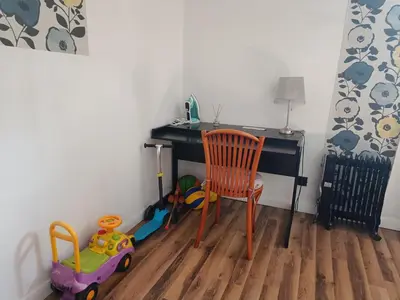 a room with a desk and a chair and toys at Dom pod Krakowem - zacisze wsi 20 minut samochodem od centrum Krakowa in Pekowice