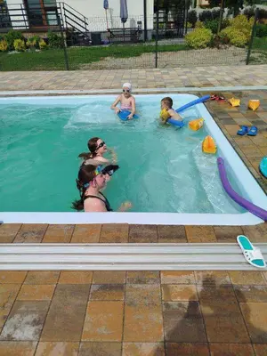 a group of people in a swimming pool at Energylandia Apartamenty u Agi D in Zator