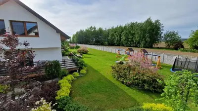 a garden in front of a house at Energylandia Apartamenty u Agi D in Zator