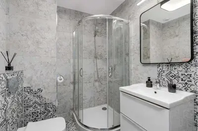a bathroom with a shower and a toilet and a sink at Air-conditioned apartment in the city center, Old Town in Kraków