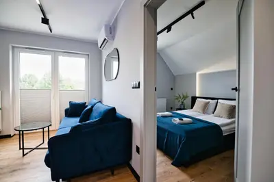 a bedroom with a bed and a couch at Jasmine by Housine in Zator