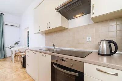a kitchen with a sink and a stove at Private Parking - Old Town - Św Krzyża 16 Street in Kraków