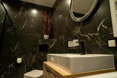 a bathroom with a sink and a mirror at Władysławka in Rabka-Zdroj