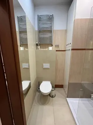 a small bathroom with a toilet and a shower at Main Square Apartment - Private Parking - Św Krzyża 16 in Kraków