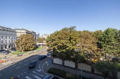 a view of a city street with cars on the road at 1-Bedroom Apartment - Długa 65 Street in Kraków