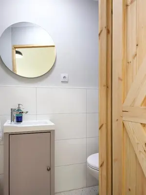 a bathroom with a sink and a mirror on the wall at Yellow Studio - Kochanowskiego in Kraków