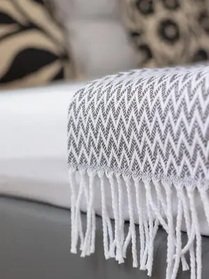 a close up of a white ottoman at Studio Apartment - Radziwiłłowska 27 in Kraków