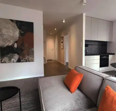 a white room with a bed and two windows at Wrocławska 53 - Duży i Wygodny apartament in Kraków