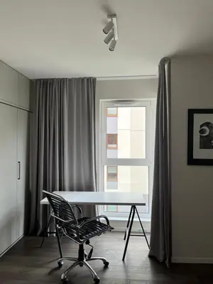 a living room with a couch and a table at Wrocławska 53 - Duży i Wygodny apartament in Kraków