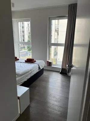 a kitchen with a sink and a table with chairs at Wrocławska 53 - Duży i Wygodny apartament in Kraków