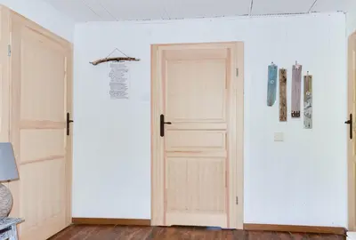 an open door in a room with white walls at Domek Jędrusiówka in Sułkowice
