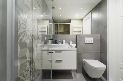 a bathroom with a white sink and a toilet at Kazimierz District - Miodowa 32 Street in Kraków