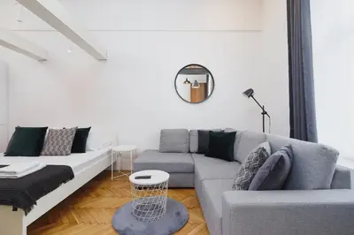 a living room with a couch and a table at Kazimierz District - Miodowa 32 Street in Kraków